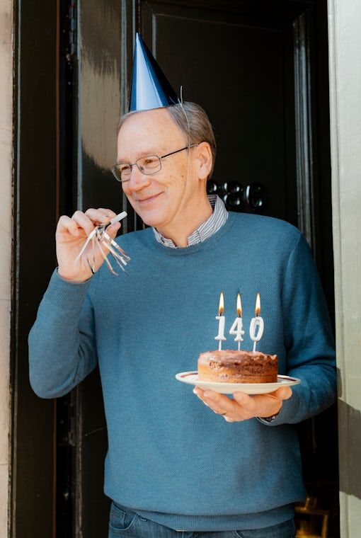 Celebrating 140 years at the front door, cake, keys and a Georgian doorway