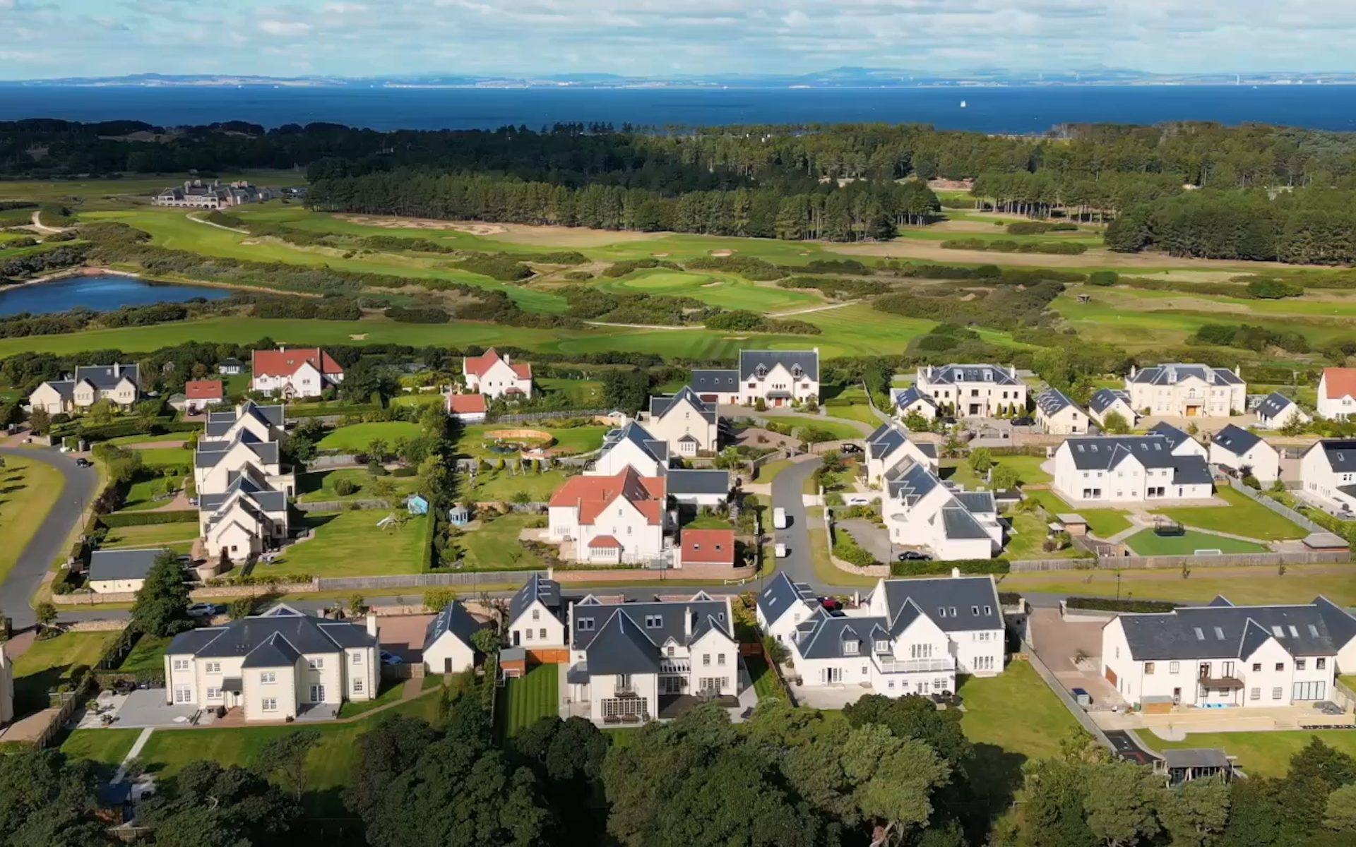 Aerial of a Simpson & Marwick coastal enclave beside the golf links and the sea